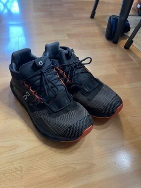On Running Men's Black Athletic Shoes with Orange Accents